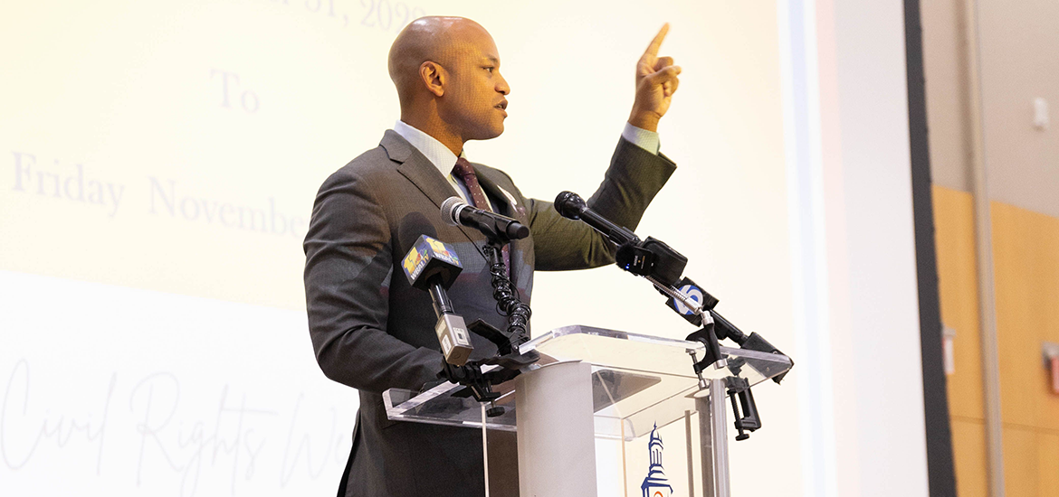 Man giving a speech at a podium